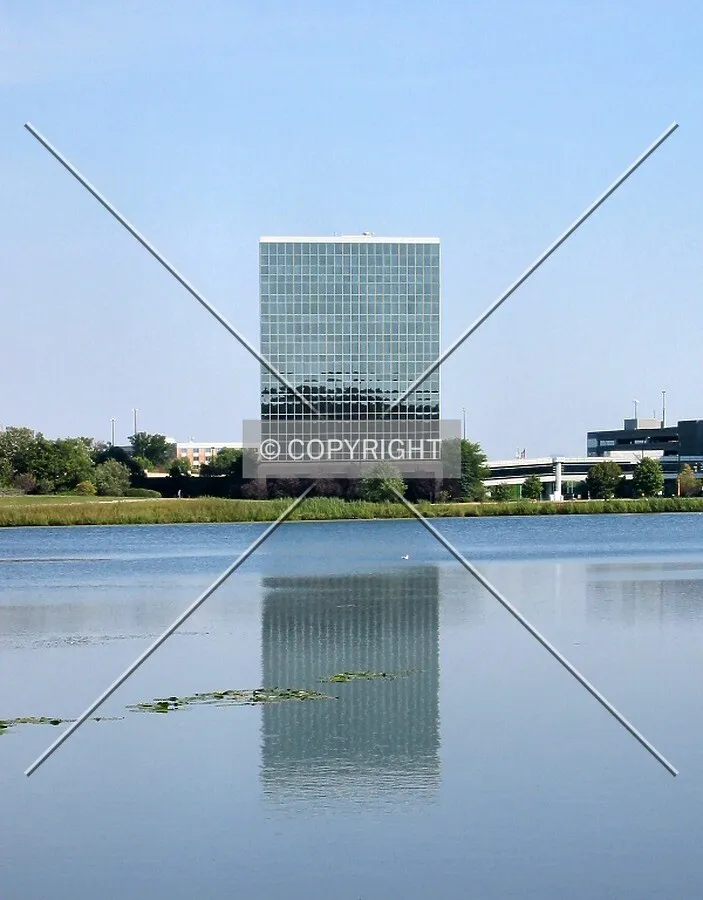 Distant view to the northeast, reflected in Hyland Lake