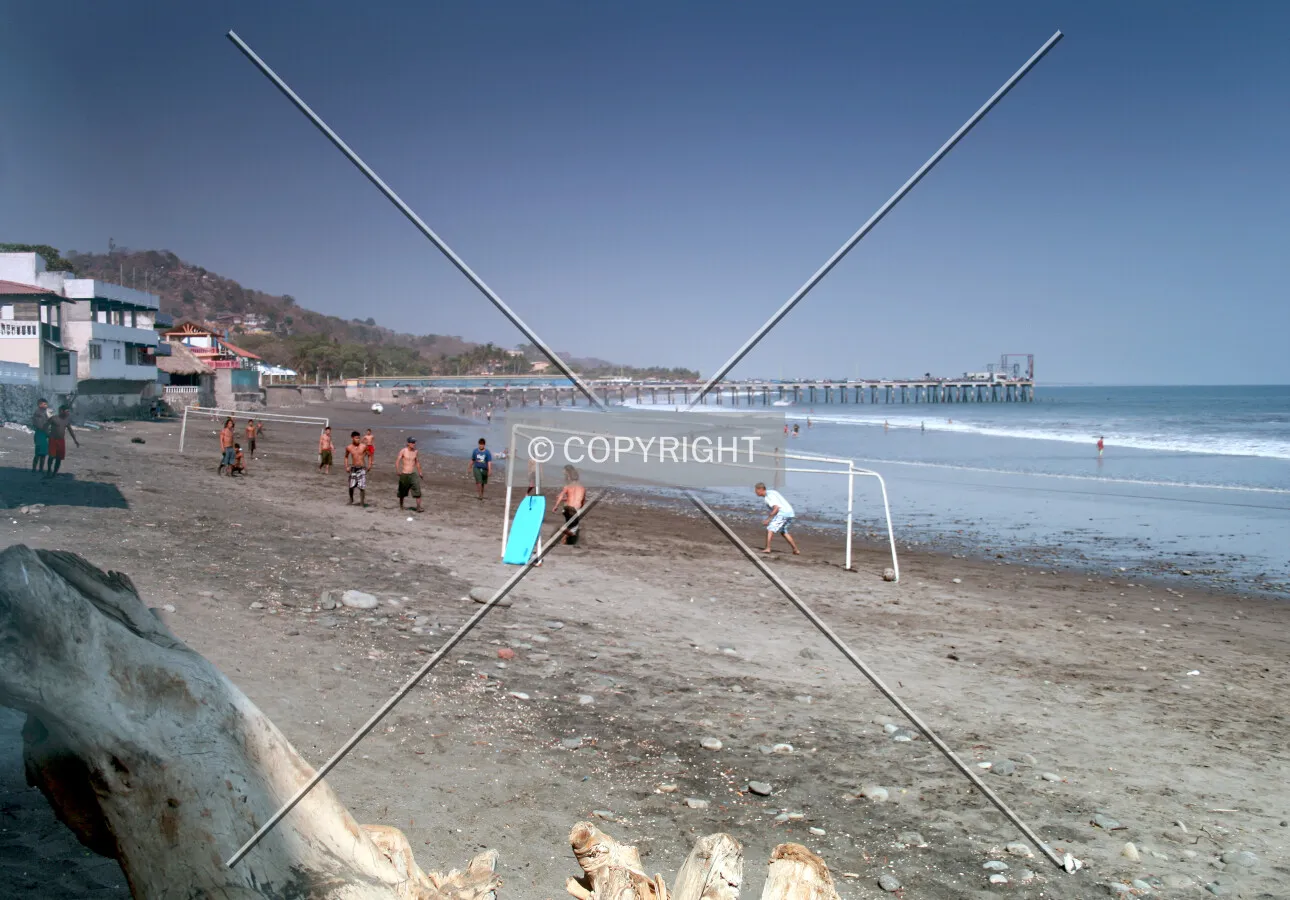A soccer game on the beach