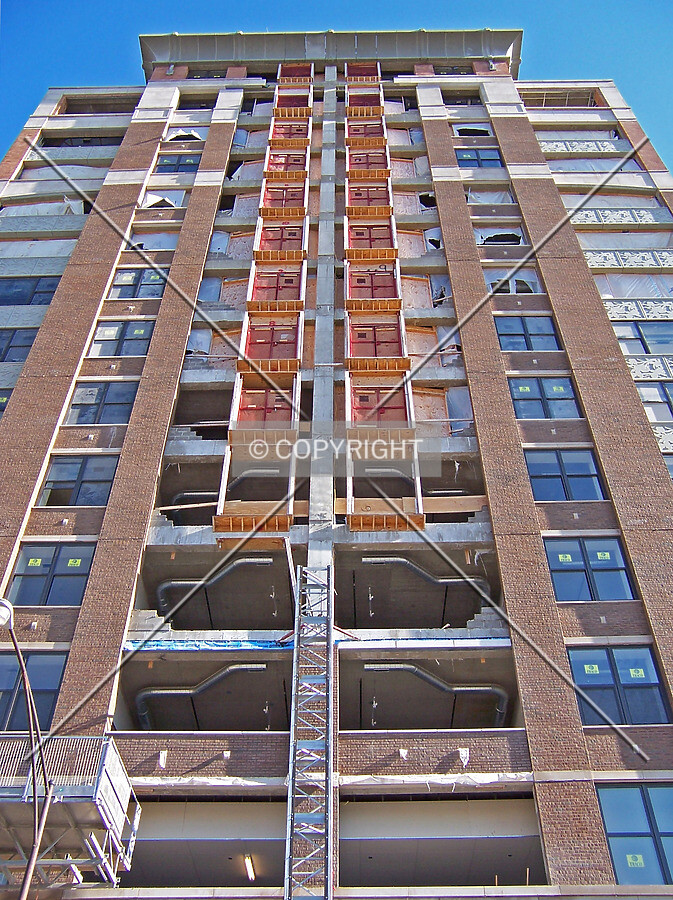 Removing the construction elevator from the north facade