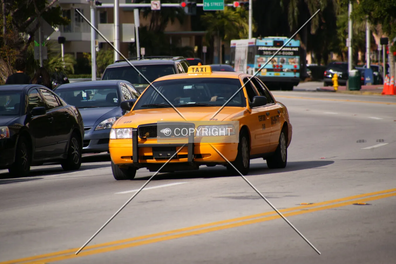 A yellow cab on a street