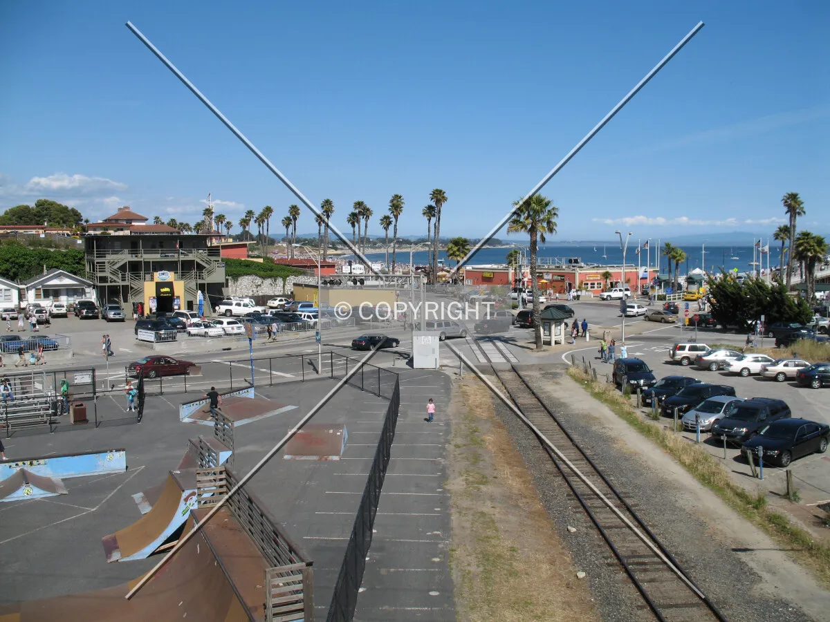 Looking east across the slow intersection of Pacific Avenue and Beach Street toward Santa Cruz Beach and the Boardwalk