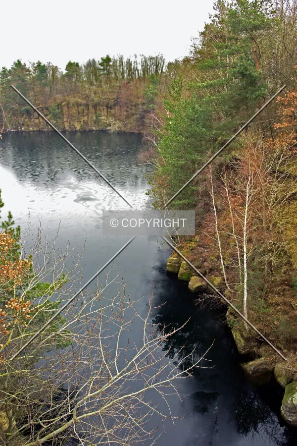 A flooded stone quarry