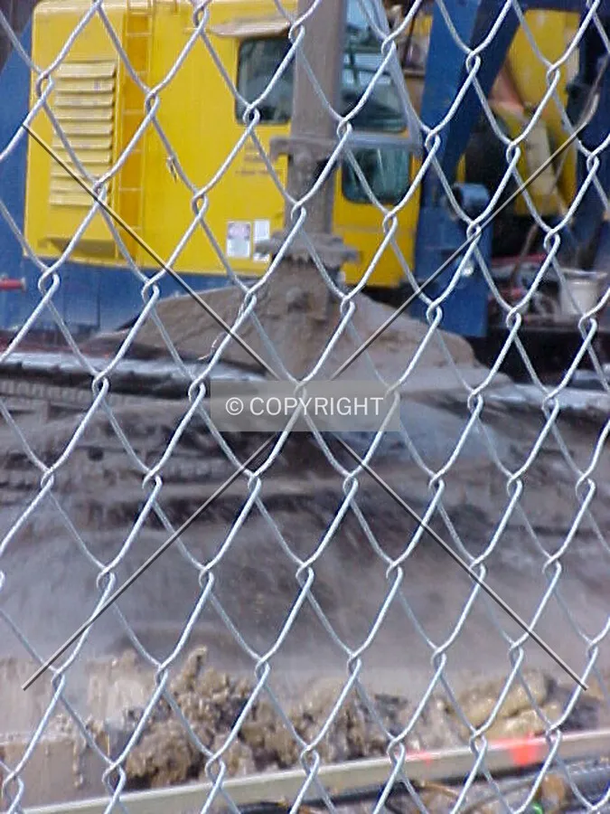 A caisson drilling machine at work, spinning mud and clay off the drill bit