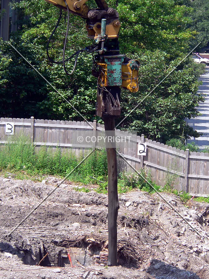 Old wood piles removed from the ground by vibration