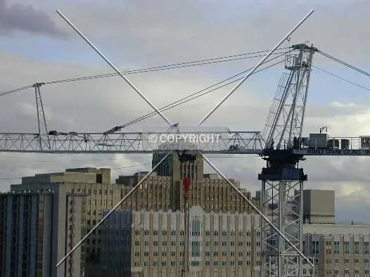 A crane rises over the site
