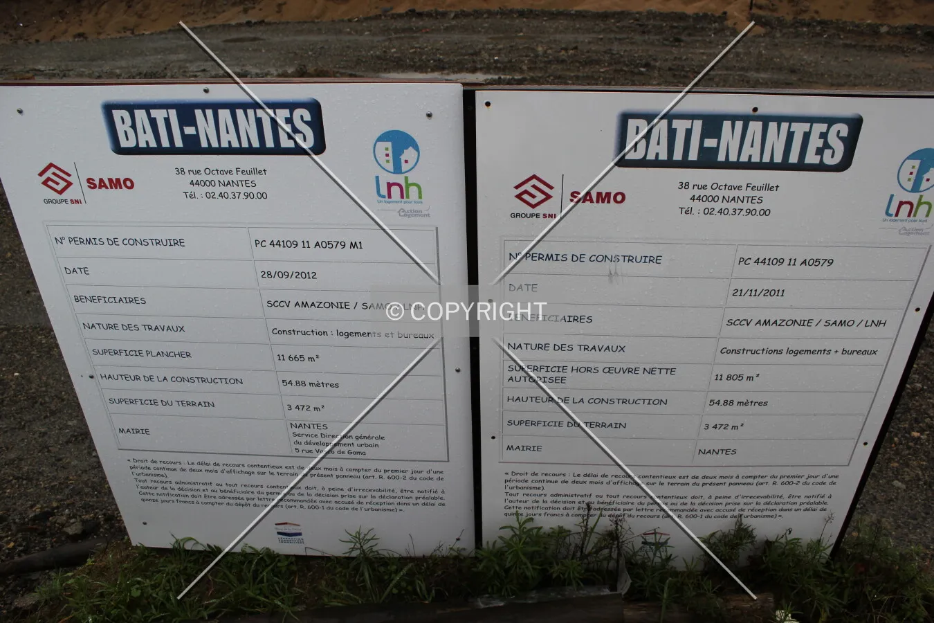 The building license shown at the construction site.