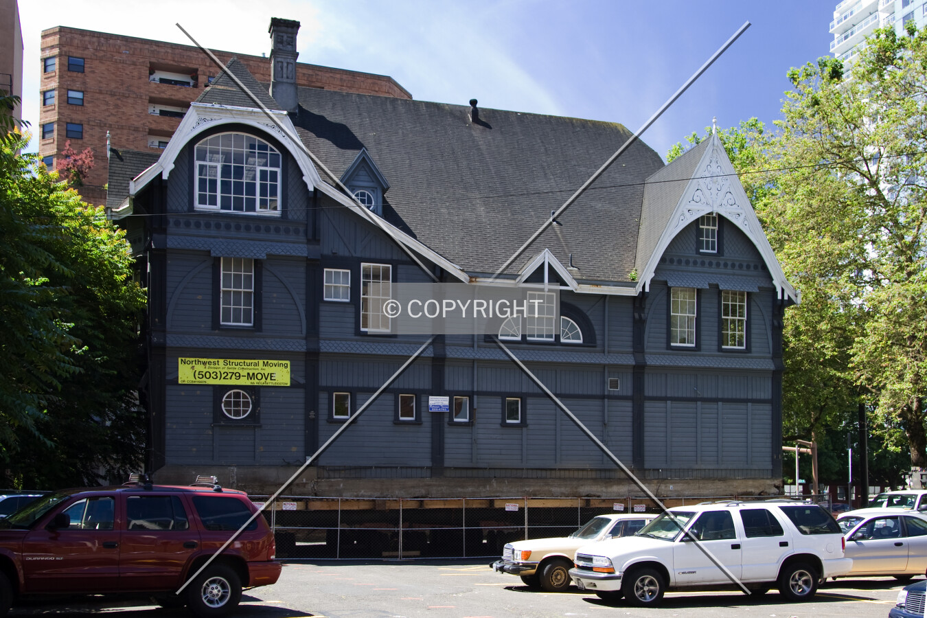 Relocated atop of surface parking lot on SW 10th Avenue and Columbia Street