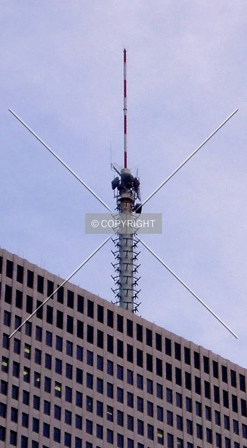 The enormous communications antenna on top of the building