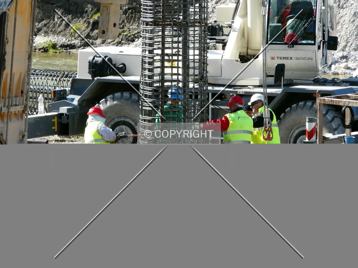 Lowering down rebars for a caisson