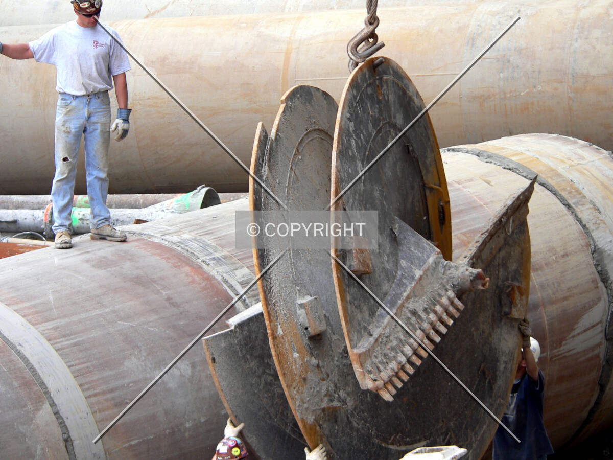 Removing an auger from the site