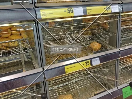 Half empty shelves in a self-service bakery