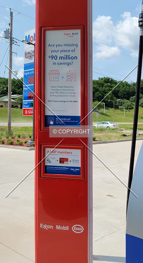 Advertisements next to a gas pump; July 2, 2021