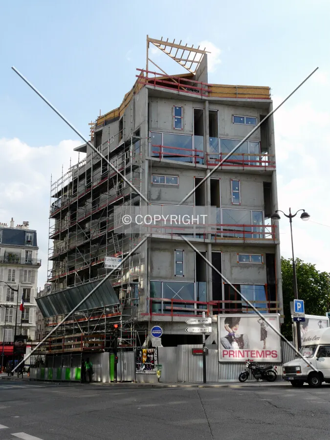 Facade installation beginning on the east side