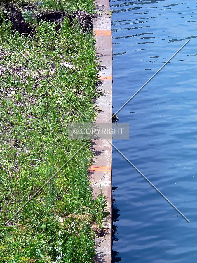Settlement marks on the seawall along Ogden Slip