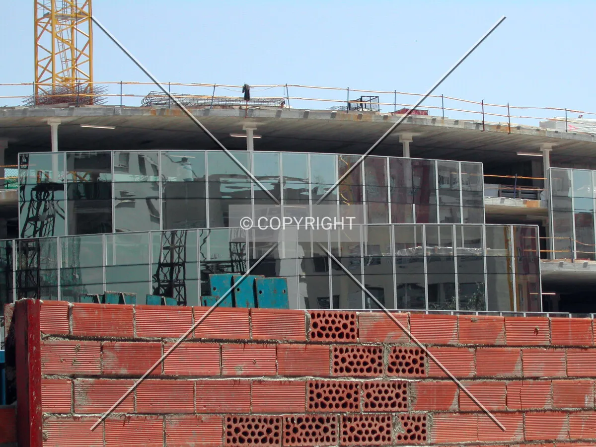 Glass curtain wall on the low-rise podium