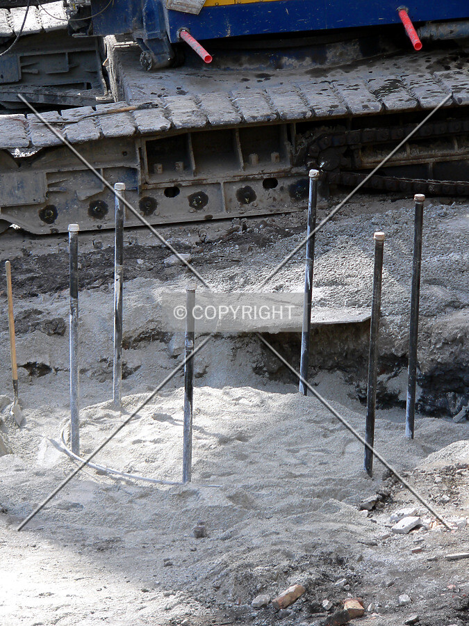 Rebar sticking out from where a caisson has been drilled