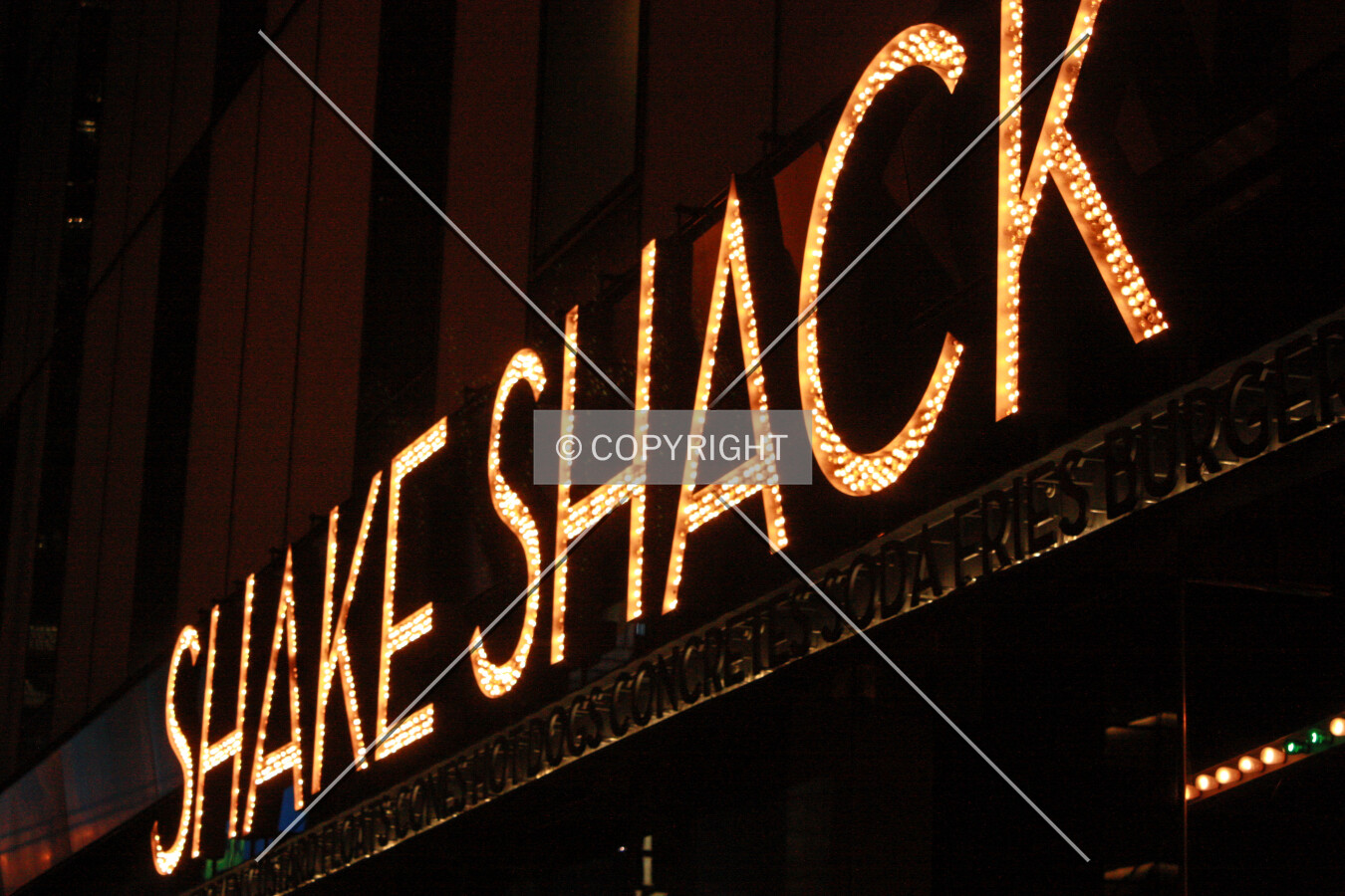 Shake Shack sign at night on the east facade