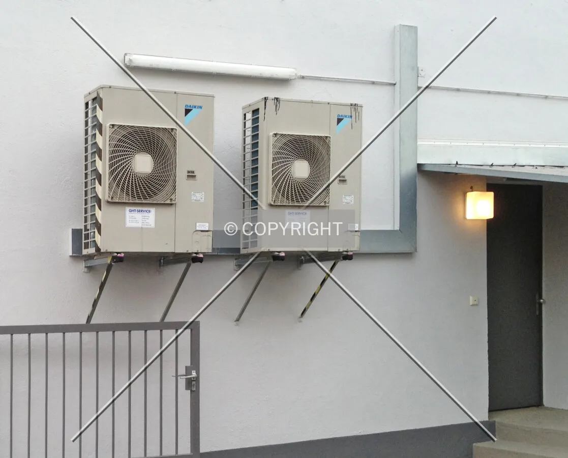 Air conditioning mounted externally at a facade
