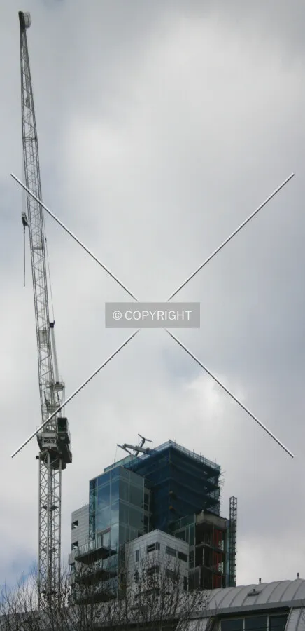 The top and tower crane in the foreground