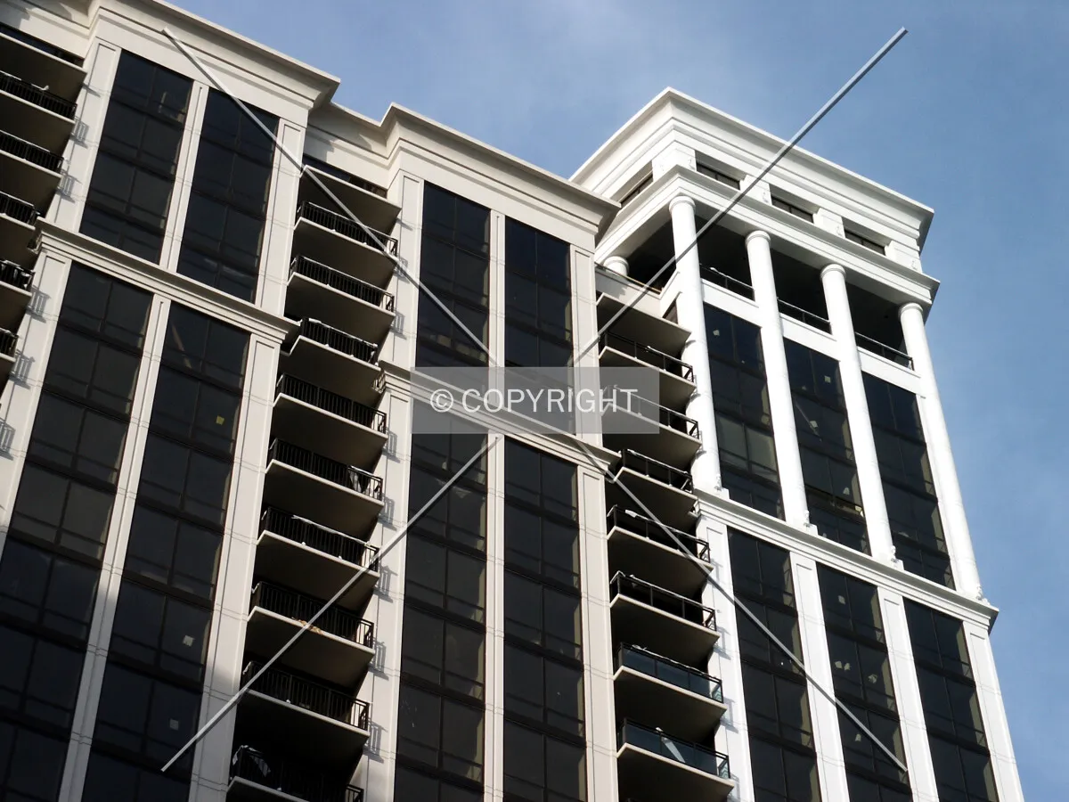 Looking up at the south facade; some balcony railings still missing