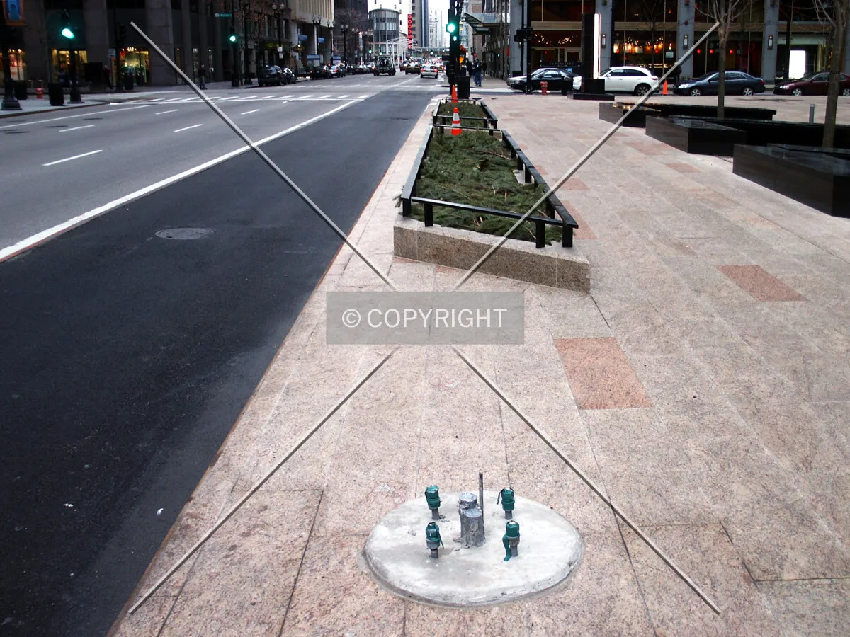 Streetlamp connection and planters on Dearborn Street in front of the plaza