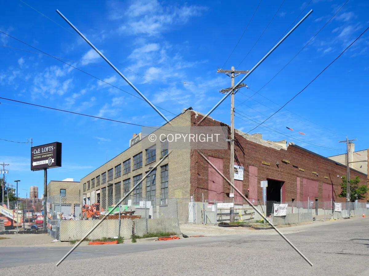View to the northwest across Raymond Avenue, construction will rise above this historic building