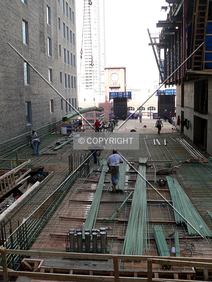 View to the north along the west side of the core as workers install rebar