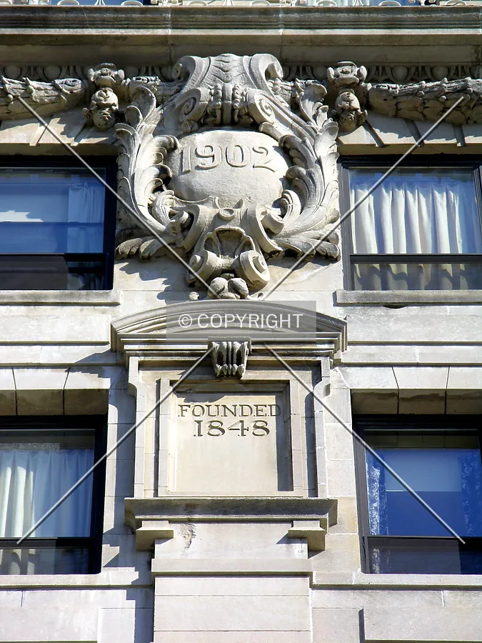 Facade details and important dates on the eastern side
