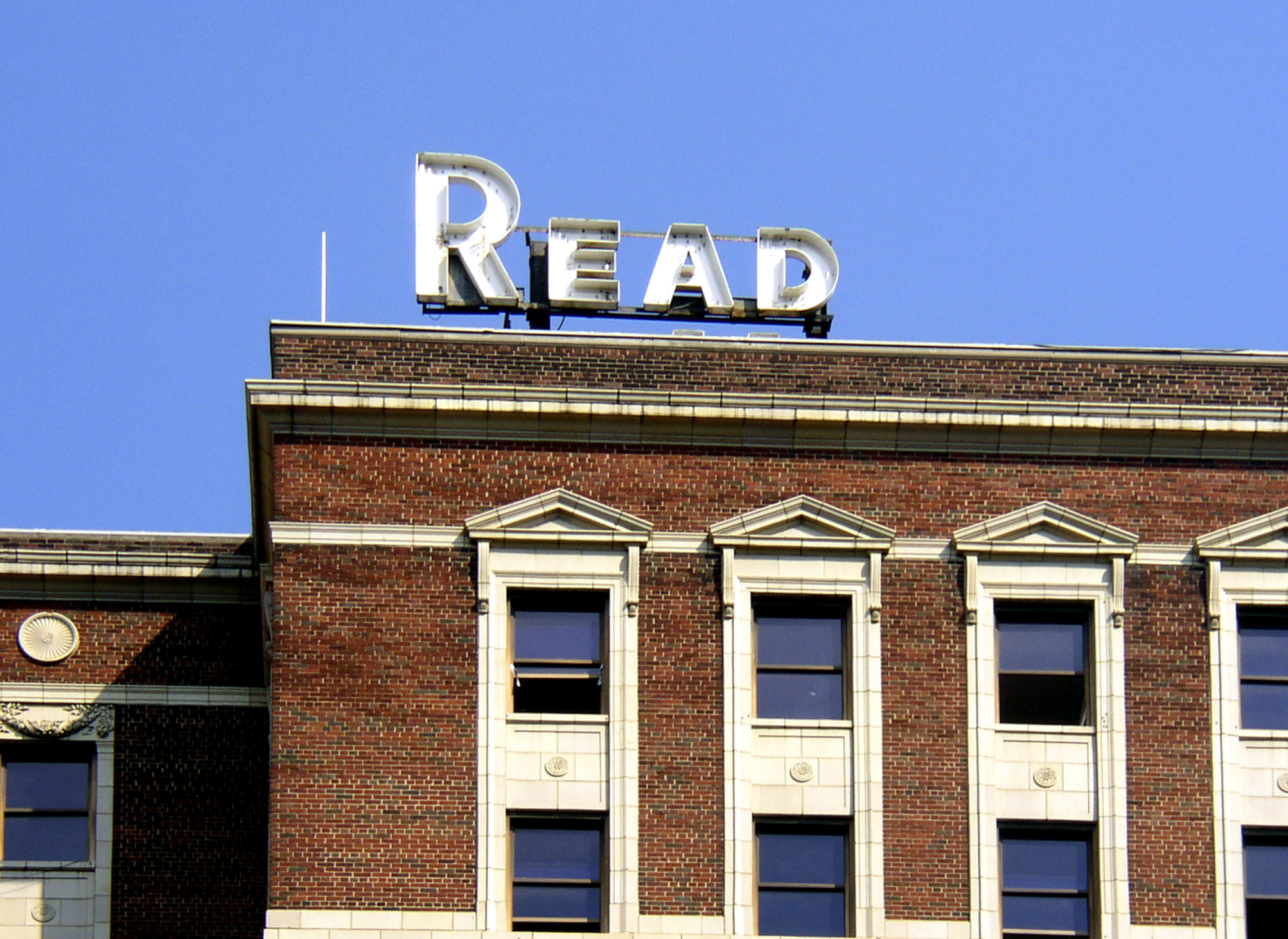 Vintage rooftop signage and facade detail