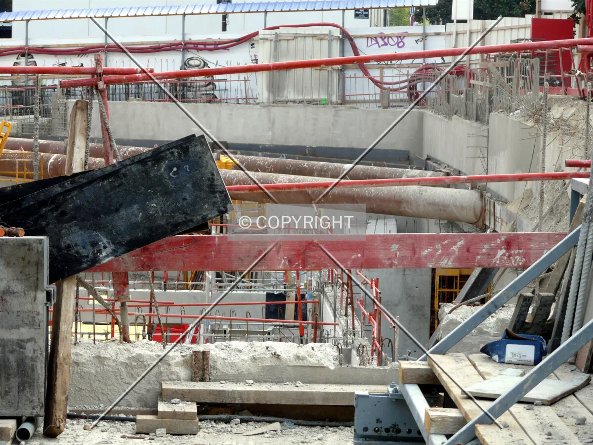 Raker beams still in place at the south corner while basement floors are rising