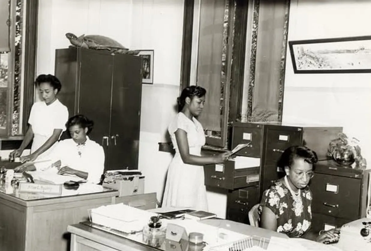 Tucker Business College graduates working in the office; 1950
