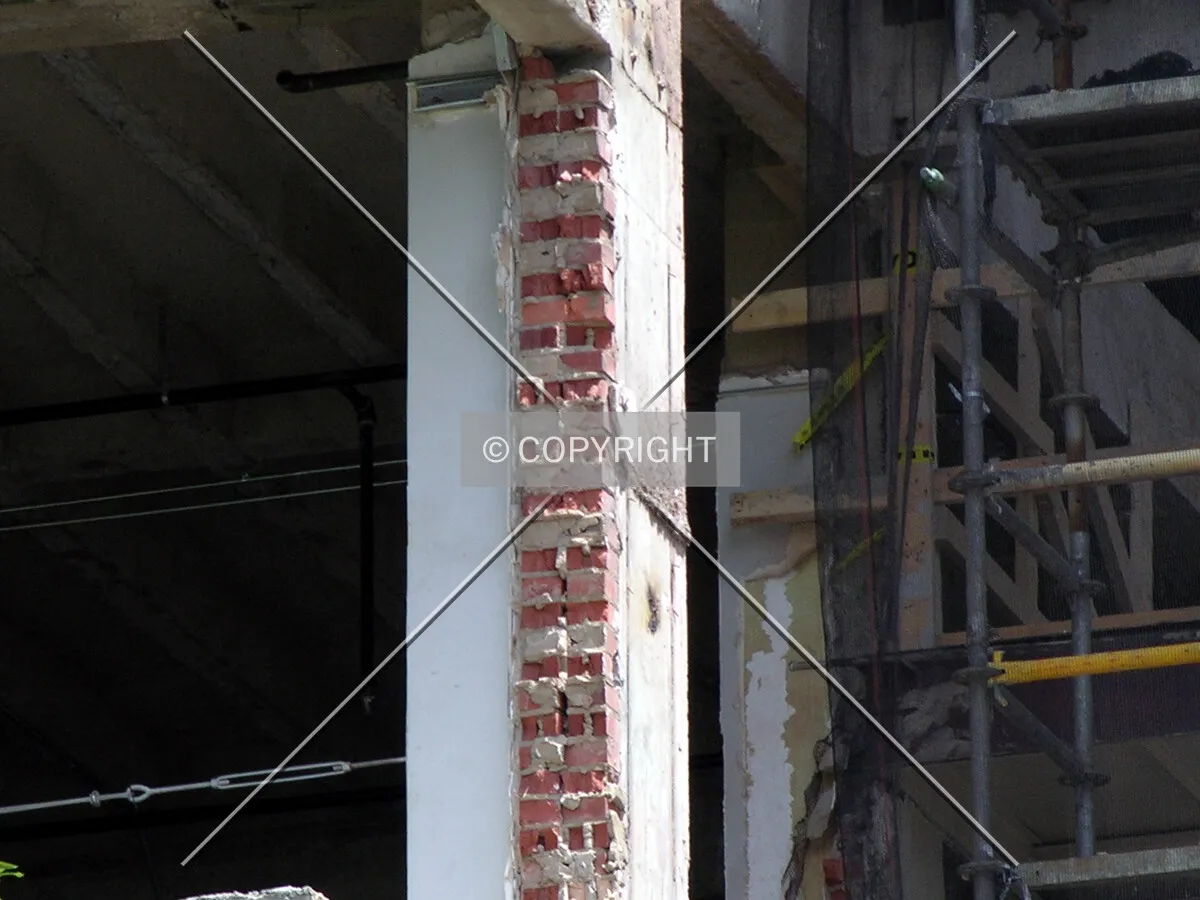 Original brickwork uncovered with the removal of the western facade