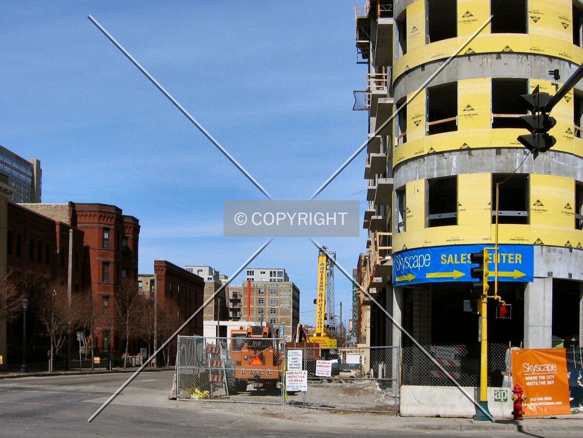 View to the north along Portland Avenue, from across 10th Street South, the Sexton in the distance