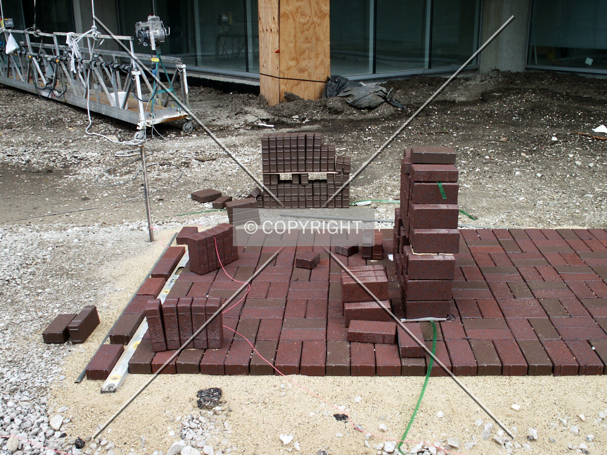 Sidewalk under construction by the northeast corner