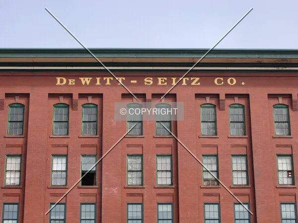 Original building name under the cornice line