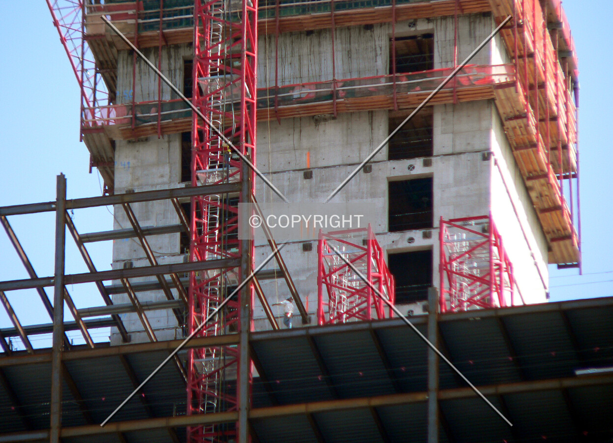 Tower crane sections, building structure and the core visible as seen from North Wells Street