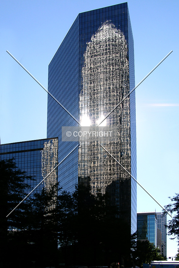 Looking southeast from Tryon Street with the Bank of America Corporate Center in the reflection