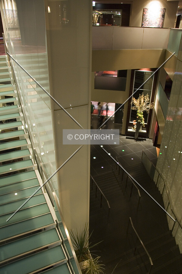 Looking down the staircase from lonking the lobby and 1st floor