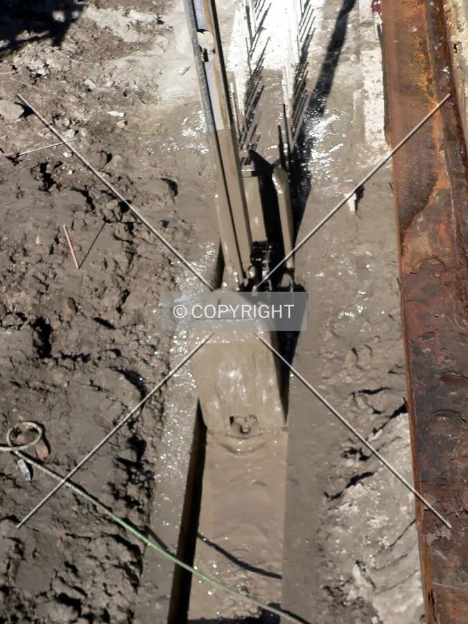 Slurry wall excavator entering the trench