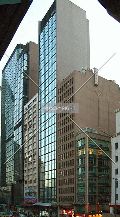 The tallest of the 3 buildings in the foreground
