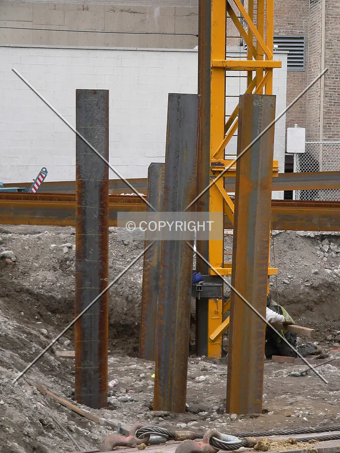 Steel piles sticking out of the ground