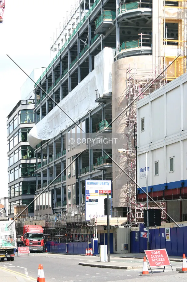 View northeast along Charterhouse Street from Holborn Circus with façade installation progress at right