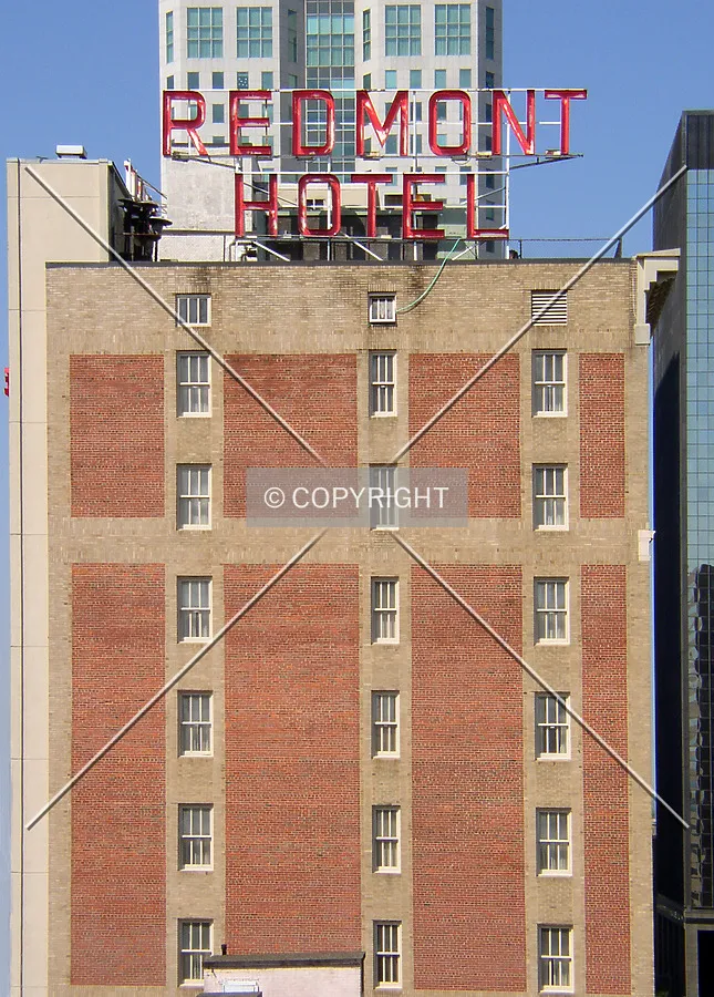 Looking west towards the upper floors and signage from an adjacent parking garage