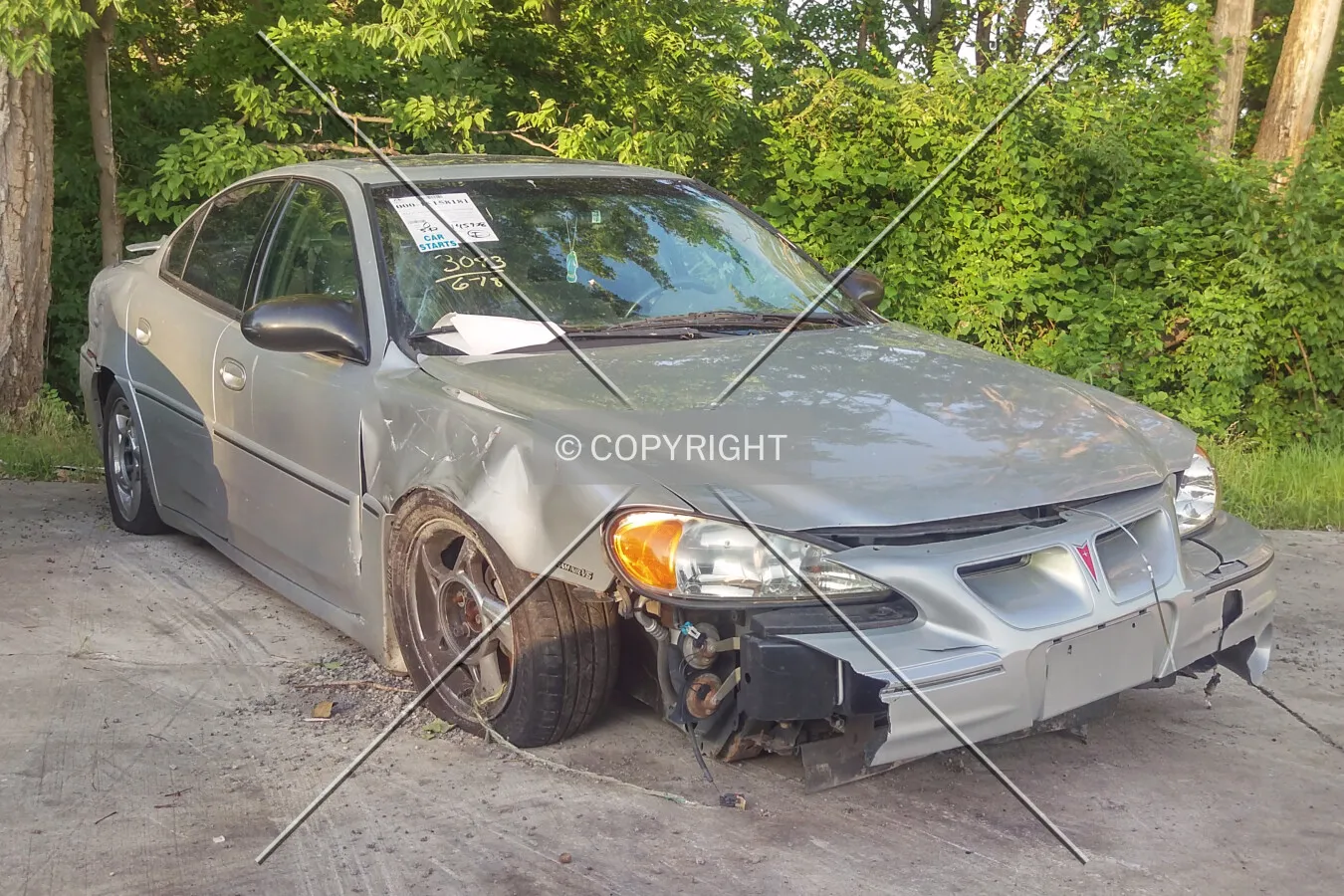 A wrecked Pontiac Grand Am sold at the auto auction; June 20, 2015