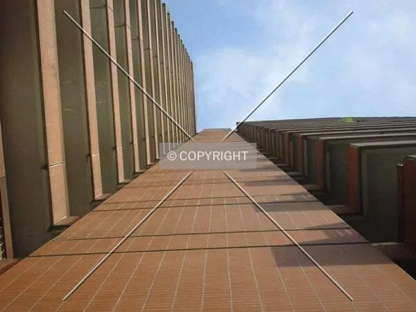 View along the facade to the top
