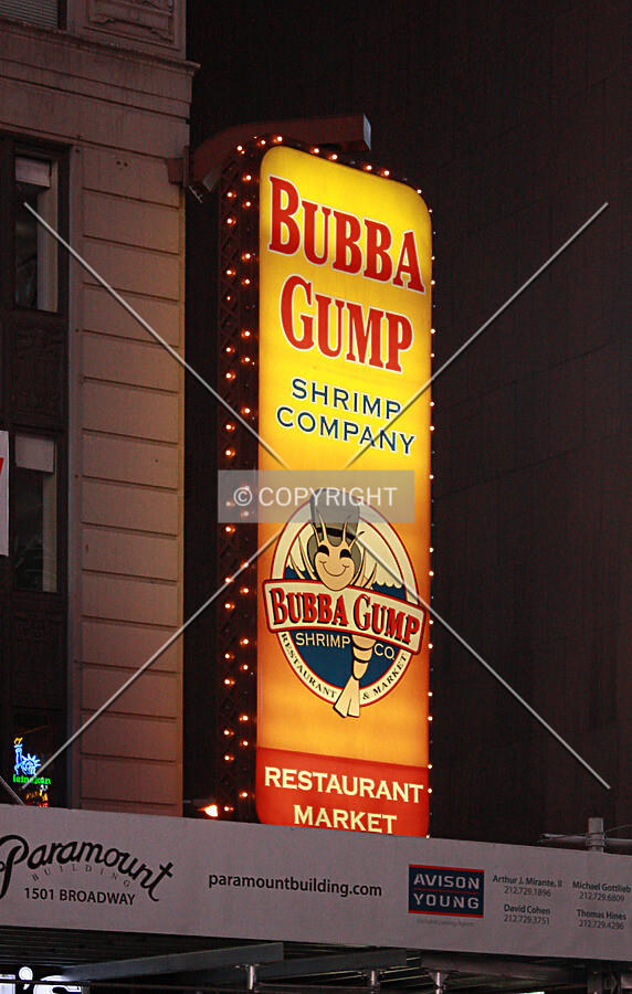 Bubba Gump Shrimp Company sign on the northeast corner at night; April 26, 2014