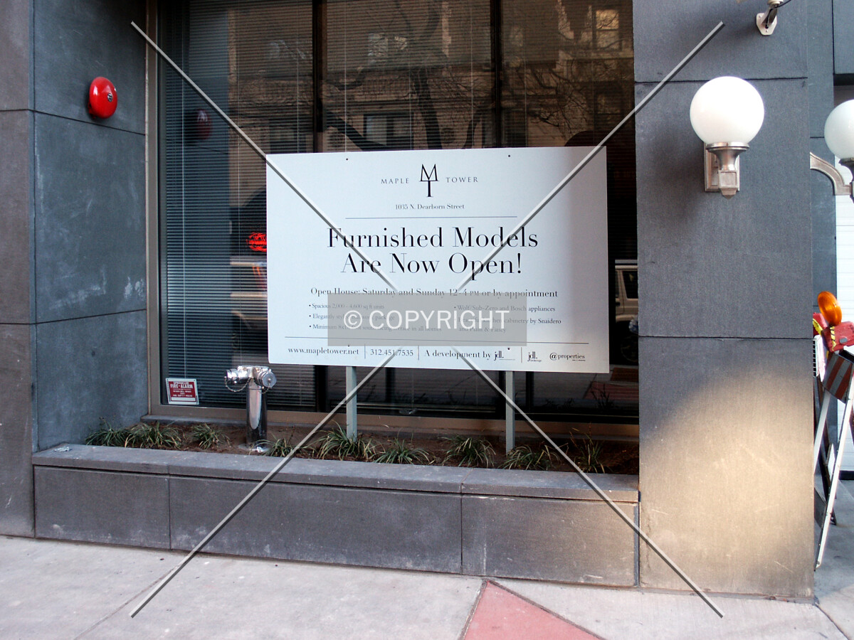 Advertisement for model units in front of the south lobby window