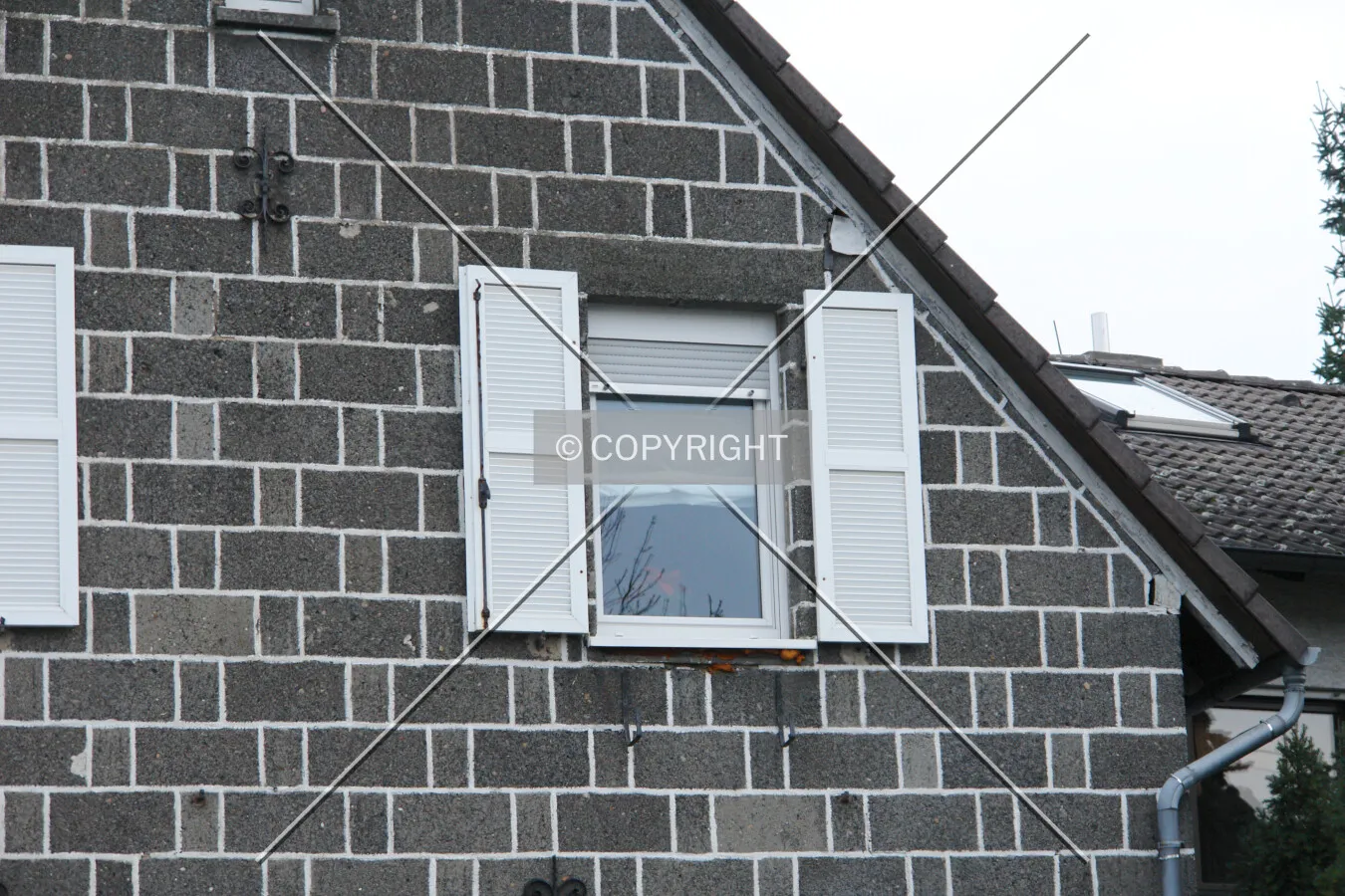 Typical outdoor window screens on a house
