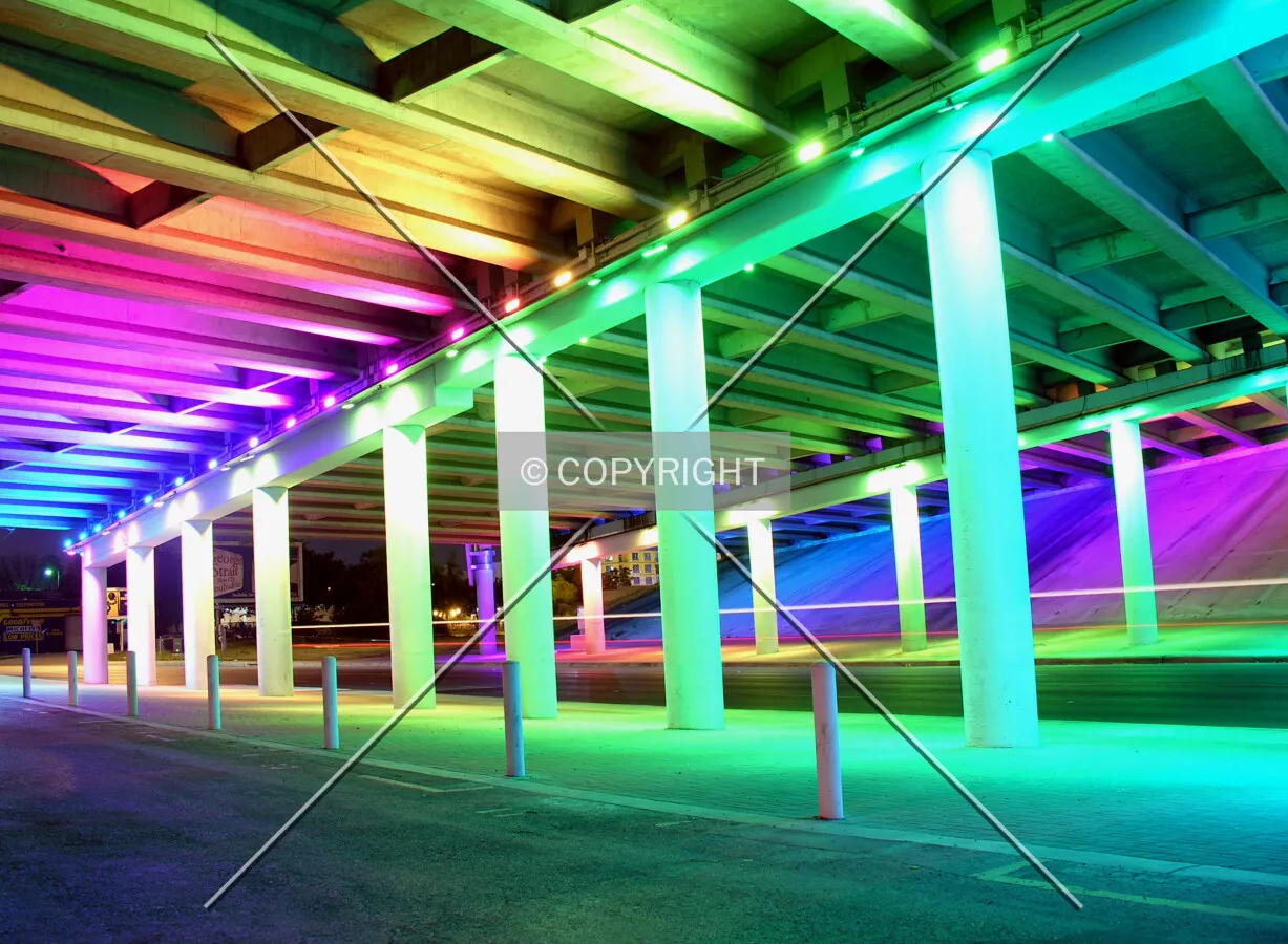 Neon lights under city expressway