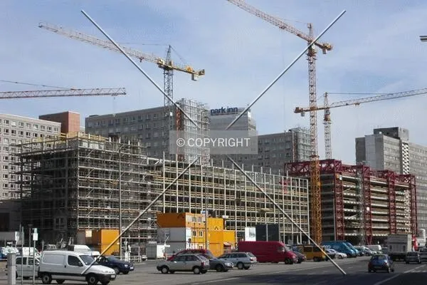 View of the building with the parking garage under construction on the right
